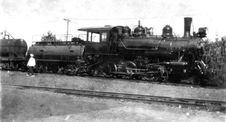 Photo of a locomotive in motion at Kona Sugar Cane Company. 